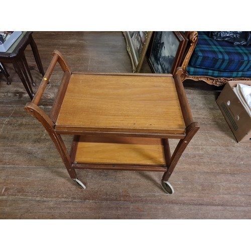 39 - Vintage wooden serving trolley with removable trays on casters.