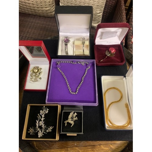 195 - Selection of costume jewellery to include brooches and Rennie Macintosh watch and bangle set etc.