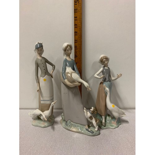 64 - 3 x Lladro farm girl figurines.
tallest 27cm