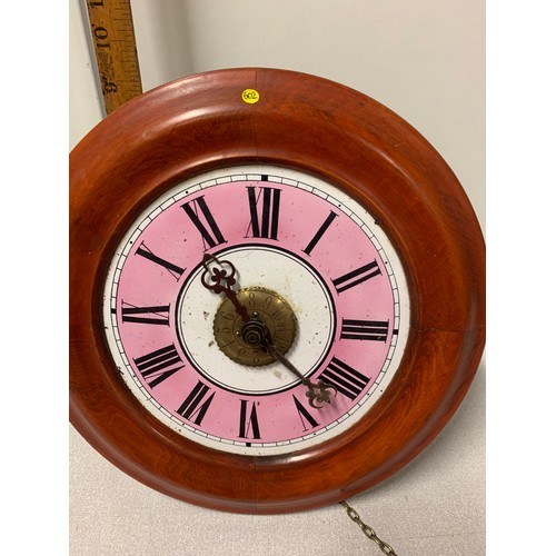 117 - Vintage wood framed wall clock with enamel and brass face - with weights and pendulum.