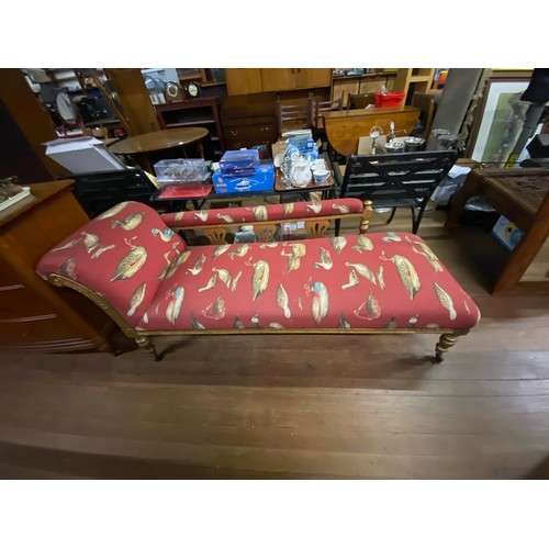 42 - Wood framed Chaise Lounge upholstered in red duck fabric.
180cm long x 75cm high