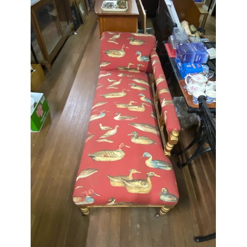 42 - Wood framed Chaise Lounge upholstered in red duck fabric.
180cm long x 75cm high