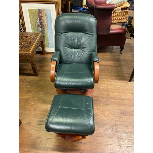 132 - Green leather Dutailier Avantglide reclining lounge chair with matching stool.