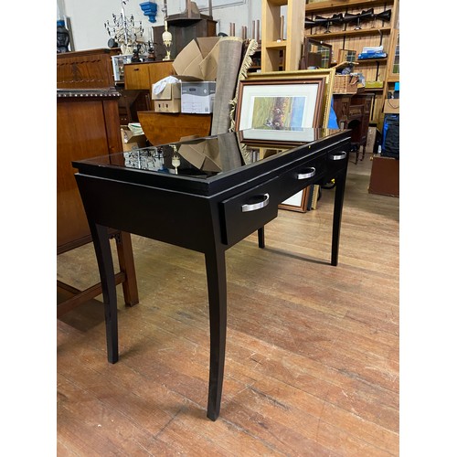 145 - Modern black glass topped console table with 3 drawers
120cm long x 50cm x 75cm