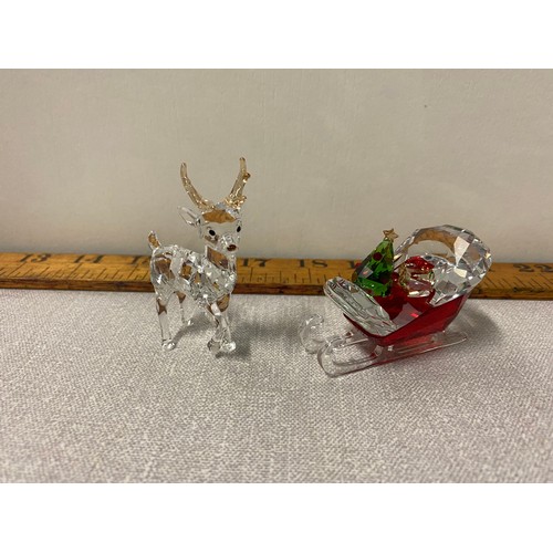 11 - Swarovski crystal Reindeer (with box) and Swarovski crystal sleigh.