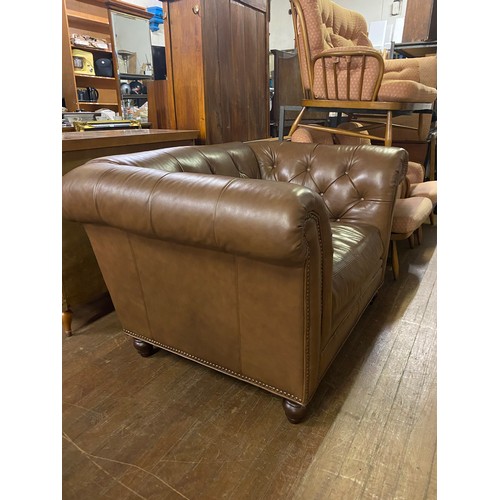 241 - Large brown leather Chesterfield style love chair. 145cm l x 105cm d x 84cm h