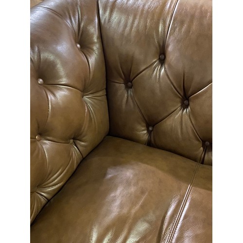 241 - Large brown leather Chesterfield style love chair. 145cm l x 105cm d x 84cm h