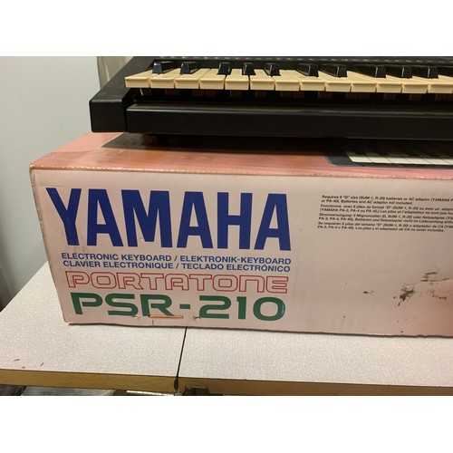 317 - Boxed Yamaha Portatone psr-210 keyboard with, instruction manual, charger and stand.