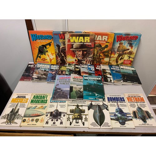 333 - Selection of military book and vintage Warlord annuals.