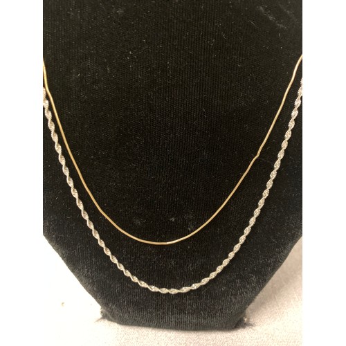 208 - Silver rope chain along with gold plate on silver chain.