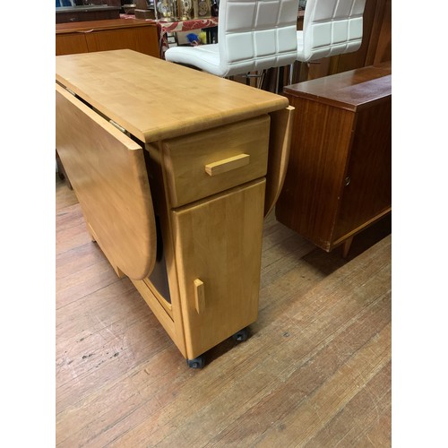 227 - Oak butterfly table and 4 matching fold away chairs with brown leather seats.