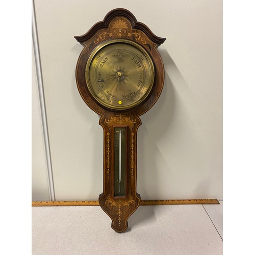 34 - Vintage inlaid wood and brass barometer.
76cm l