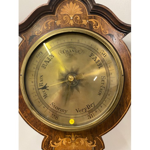 34 - Vintage inlaid wood and brass barometer.
76cm l