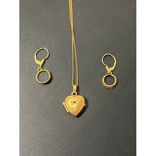 150 - Rolled gold locket, chain and earrings.