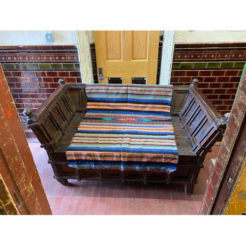 176 - Very heavy solid wood antique artisan Indian day bed/window seat with storage. Possibly made from wo... 