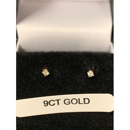 213 - Pair of 9ct gold and diamond earrings.