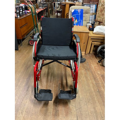 438 - New Enigma wheel chair with cushion.