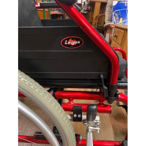 438 - New Enigma wheel chair with cushion.