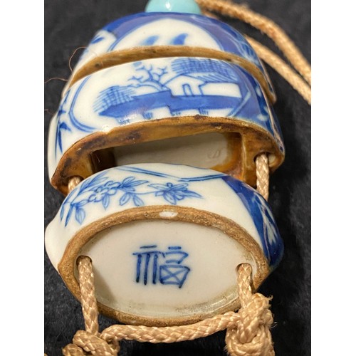 187 - Japanese hand painted blue and white Inro box suspended from an obi. To be worn around the waist whe... 