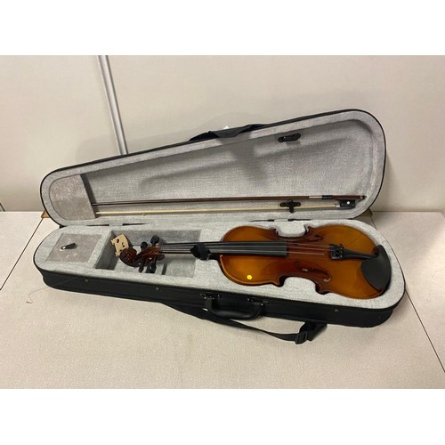 122 - Violin and bow in fitted case.