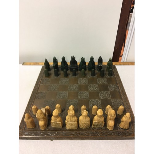 7 - Carved wooden chess board with Tudor rose design along with A. Carlton chess set in original box (sl... 