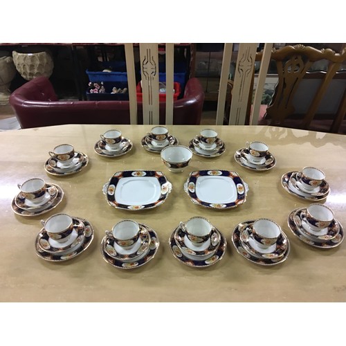 19 - Antique 39 piece Royal Albert Imari dinner set.