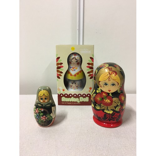 20 - 2 vintage Russian dolls and new Russian Doll salt and peppers.