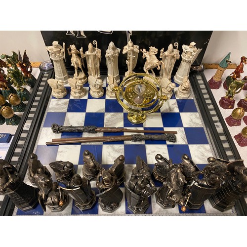 143 - Harry Potter Wizard chess set (with sound)and board along with Harry Potter dragon chess set etc.
53... 