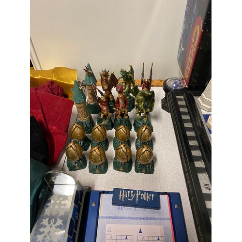 143 - Harry Potter Wizard chess set (with sound)and board along with Harry Potter dragon chess set etc.
53... 