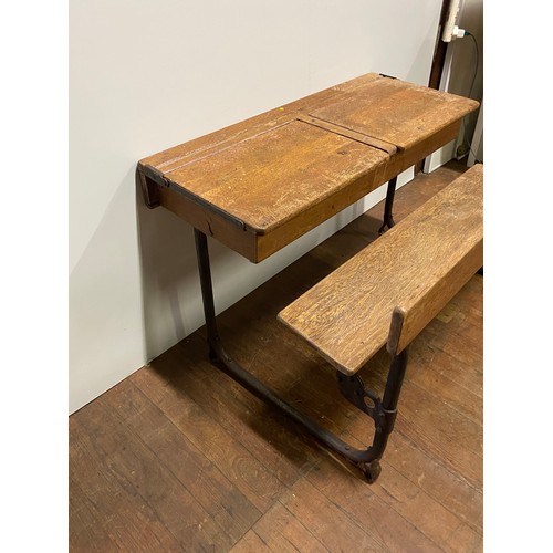 189 - Vintage wooden double school bench and desk set on metal frame.
92cm l x 68cm back to front x 55cm h