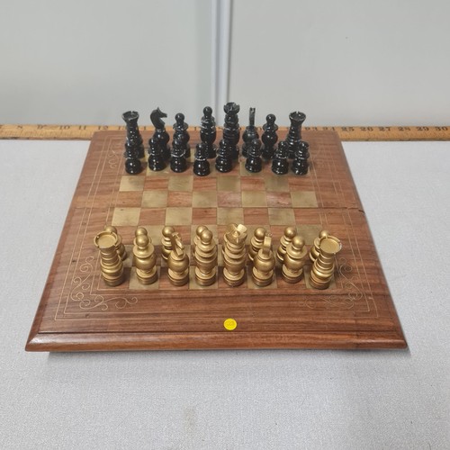 33 - Chess set with brass inlaid chess board.
30cm x 30cm