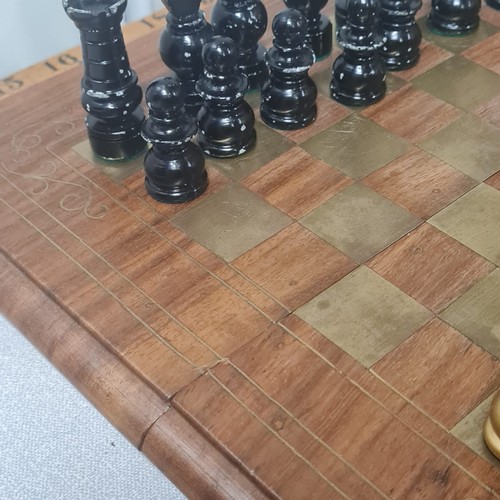 33 - Chess set with brass inlaid chess board.
30cm x 30cm