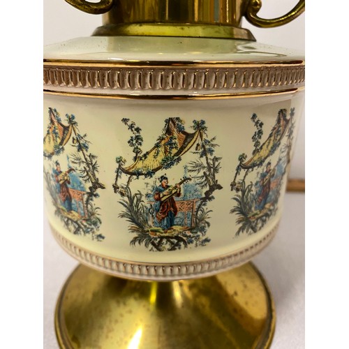 36 - Vintage brass and ceramic paraffin lamp depicting Oriental scene with green shade and glass chimney.... 