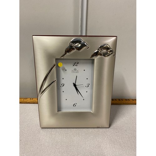 60 - Marcello Giorgio Italian silver framed clock decorated with Cala Lilies. Hallmarked to the back.
20c... 