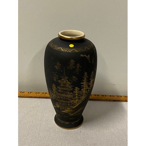 49 - Japanese Satsuma pottery vase. Matt black with hand painted gold landscape. Marked to base.
25cm h