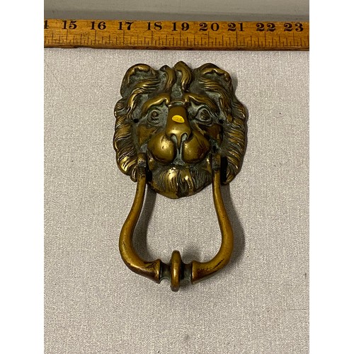 51 - Antique brass lion head door knocker.
20cm l