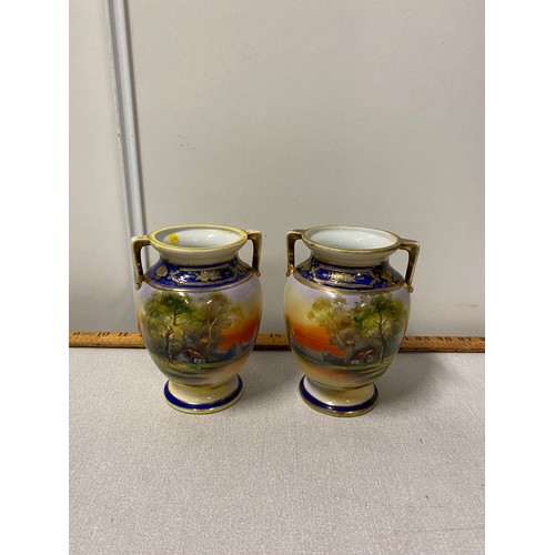 56 - Pair of hand painted Noritake vases.
16cm h