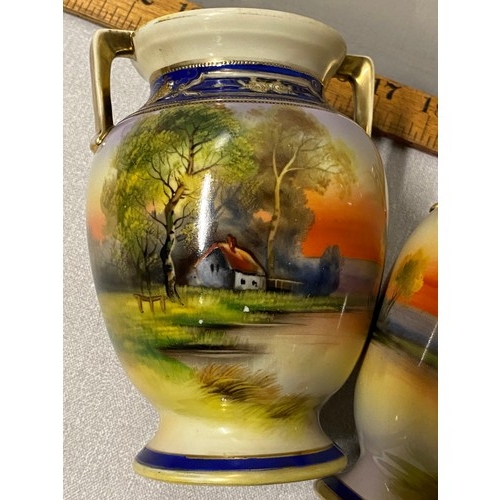 56 - Pair of hand painted Noritake vases.
16cm h