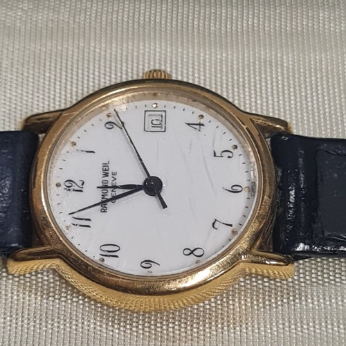 356 - ladies raymond weil 18k gold electroplated watch
face has some scratches