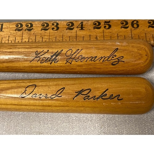 99 - 2 miniature Louisville Slugger baseball bats -Keith Hernadez and David Parker.