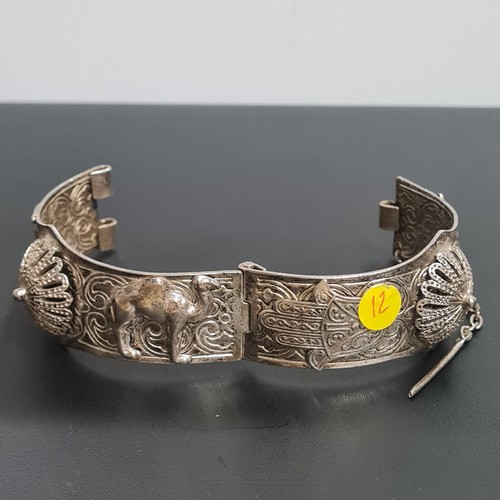 244 - Vintage white metal (possibly silver) Middle Eastern bracelet depicting camels etc.