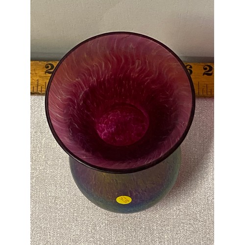 390 - Iridescent art glass vase.
16cm tall