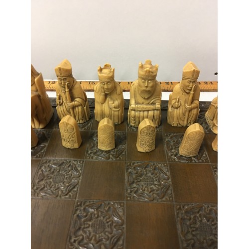 7 - Carved wooden chess board with Tudor rose design along with A. Carlton chess set in original box (sl... 