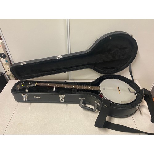 140 - Barnes and Mullins open back Ukulele Banjo in fitted hard case.