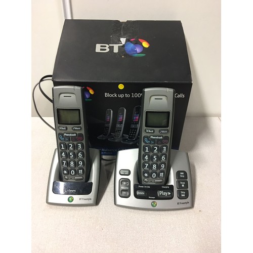 512 - BT Freestyle telephones with charging docks.