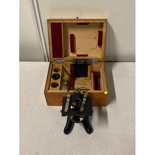 581 - Vintage microscope base in original wooden box.