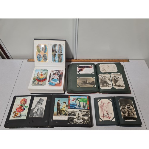 46 - 4 albums filled with vintage postcards to include original 1910 Shell Motor Spirit ones.