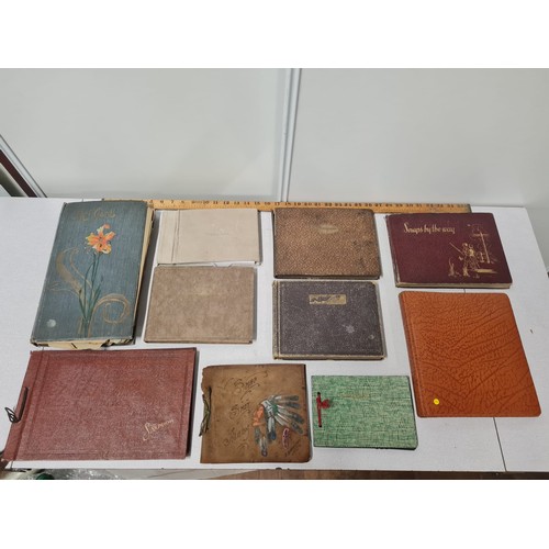 51 - 10 x antique photo albums and photographs.