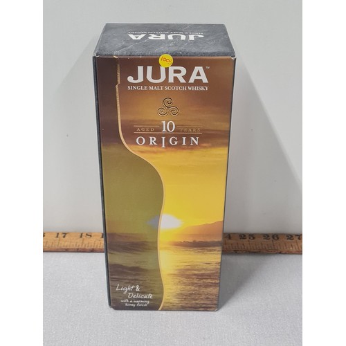 52 - Boxed bottle of Jura 10 years Origin single malt Scotch whisky.