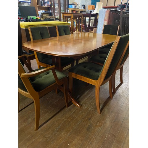 258 - Scottish Beithcraft dining table with 6 matching upholstered button back chairs.